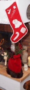 My childhood Christmas stocking and  a prized gift from my mother, a Santa trimmed with mink.