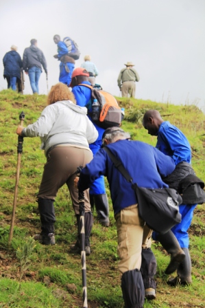 Porters help with the ascent.