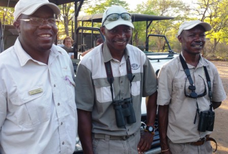Abiot, center, with fellow guides in Zimbabwe